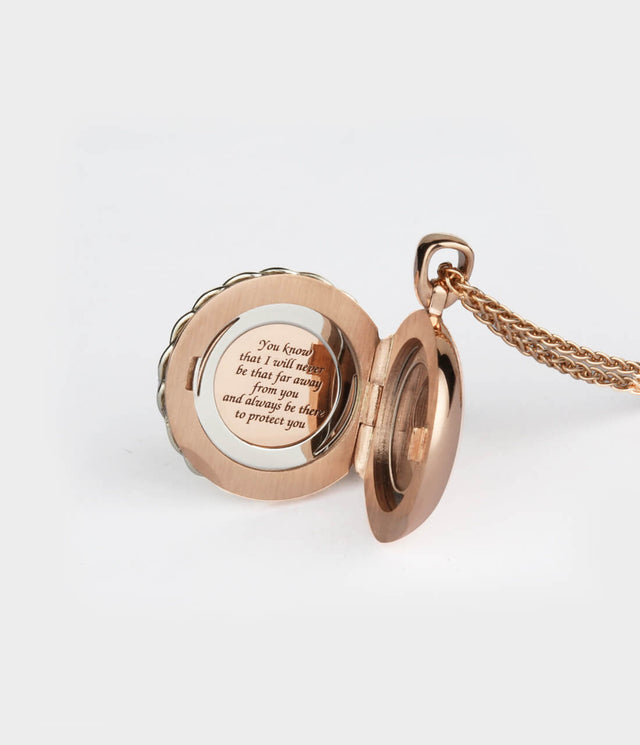 Bespoke memorial locket in rose gold with message engraving inside and St Christopher on the outside.